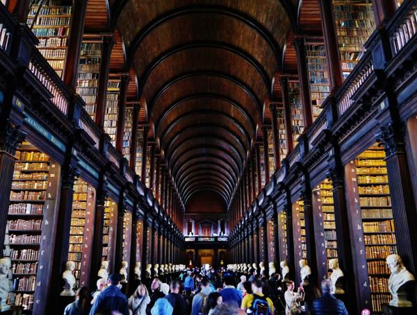 Historic 2022 view down the book-lined Long Room at Trinity College Dublin