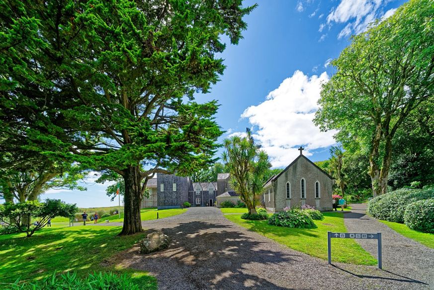 Trees, lawns and buildings within the Derrynane House grounds
