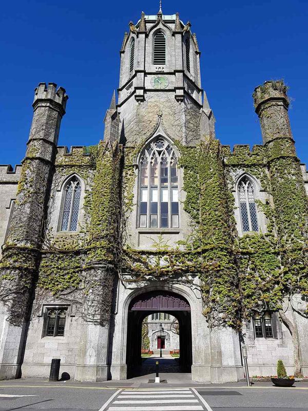 The archway and clock tower of the university Quadrangle in May 2018