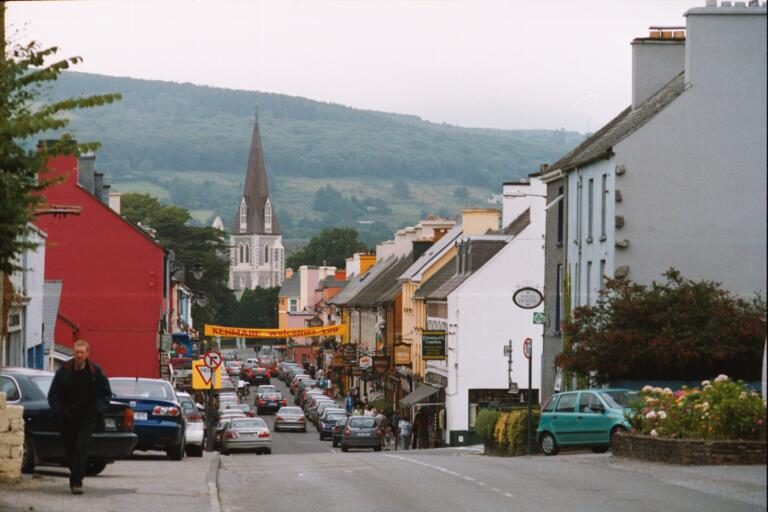 A street in Kenmare with mountains beyond