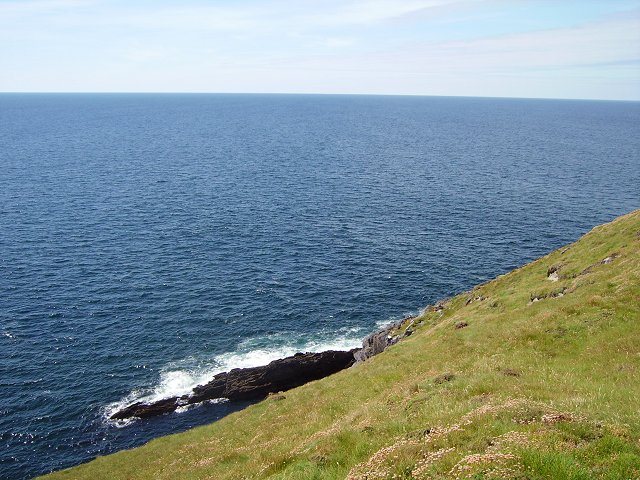 The grassy headland and Atlantic at Brow Head