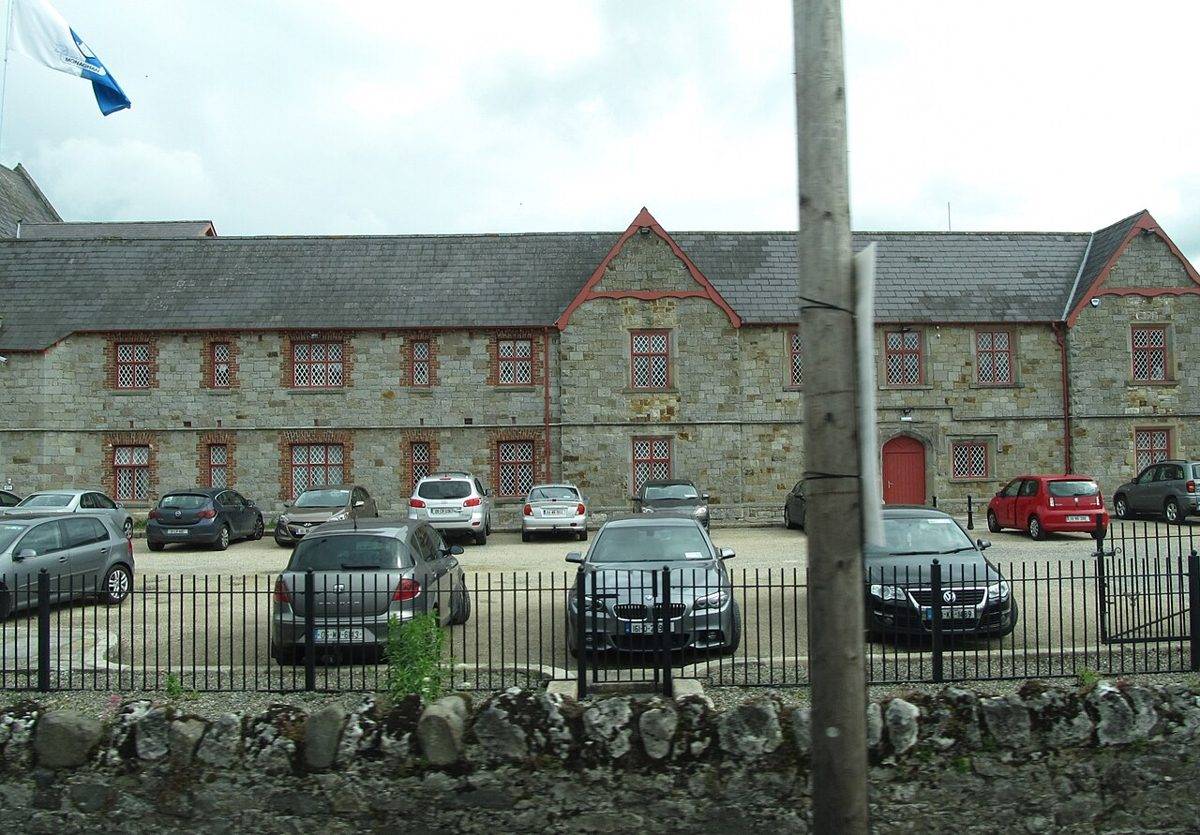 The former Carrickmacross Workhouse buildings behind their boundary railings in 2016
