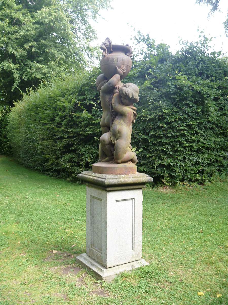 A garden statue on a plinth at Killruddery