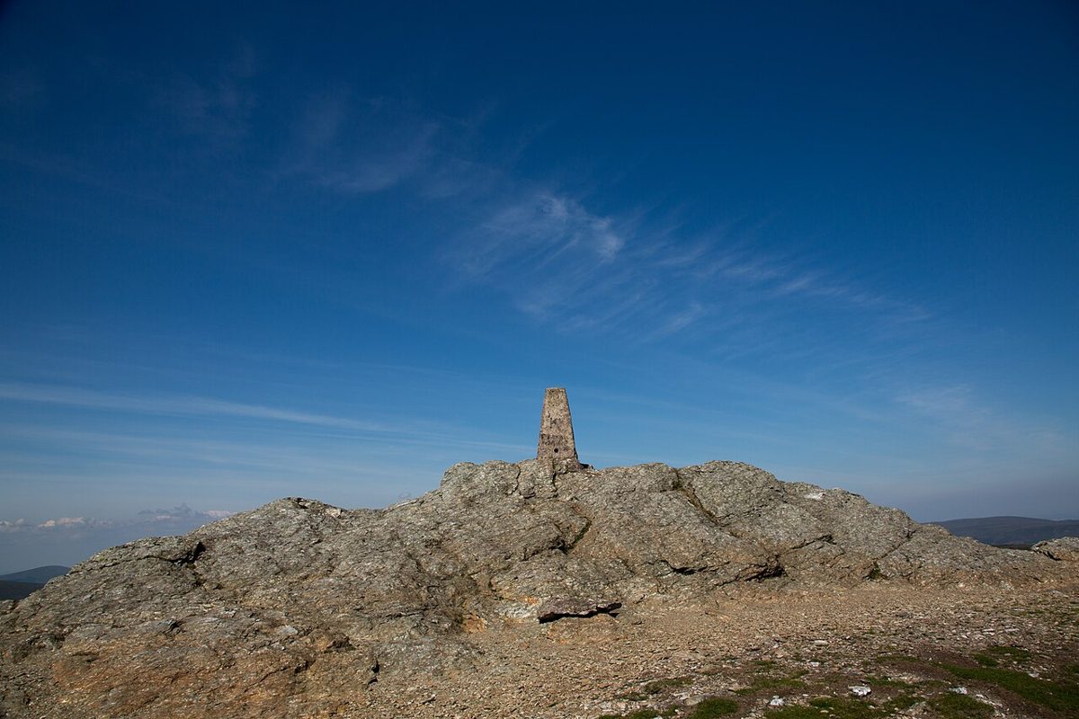 The stony summit of Djouce and its marker