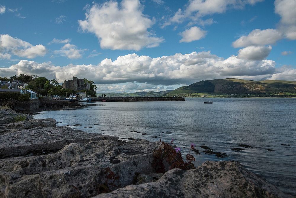 Carlingford Castle and its waterfront setting, seen across the shore