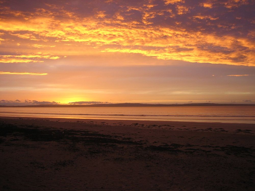 Sunset across the long sandy beach at Enniscrone