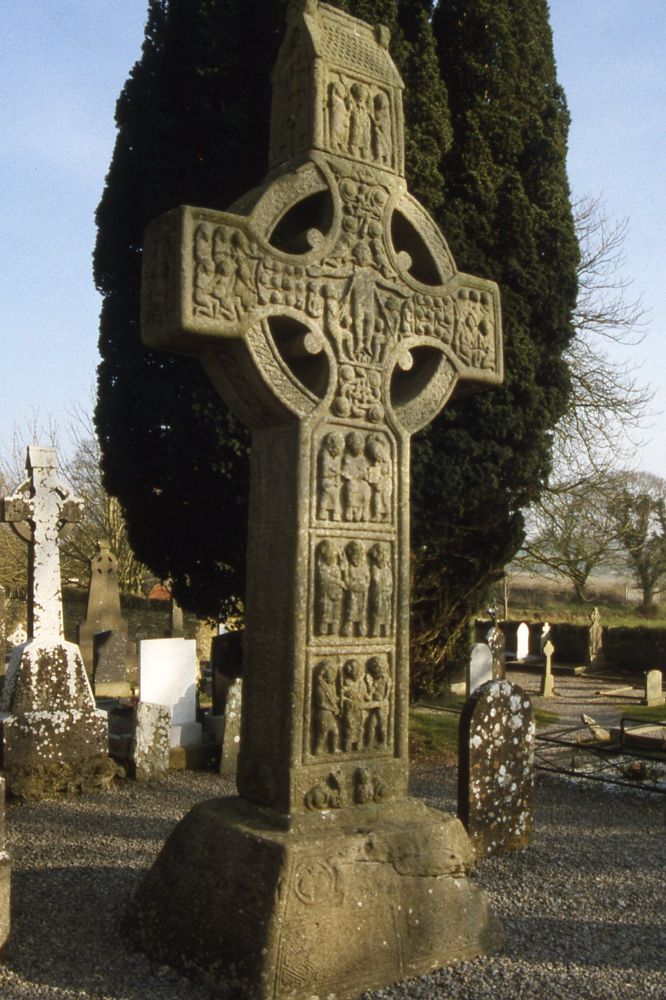 A carved high cross among the monastic remains at Monasterboice