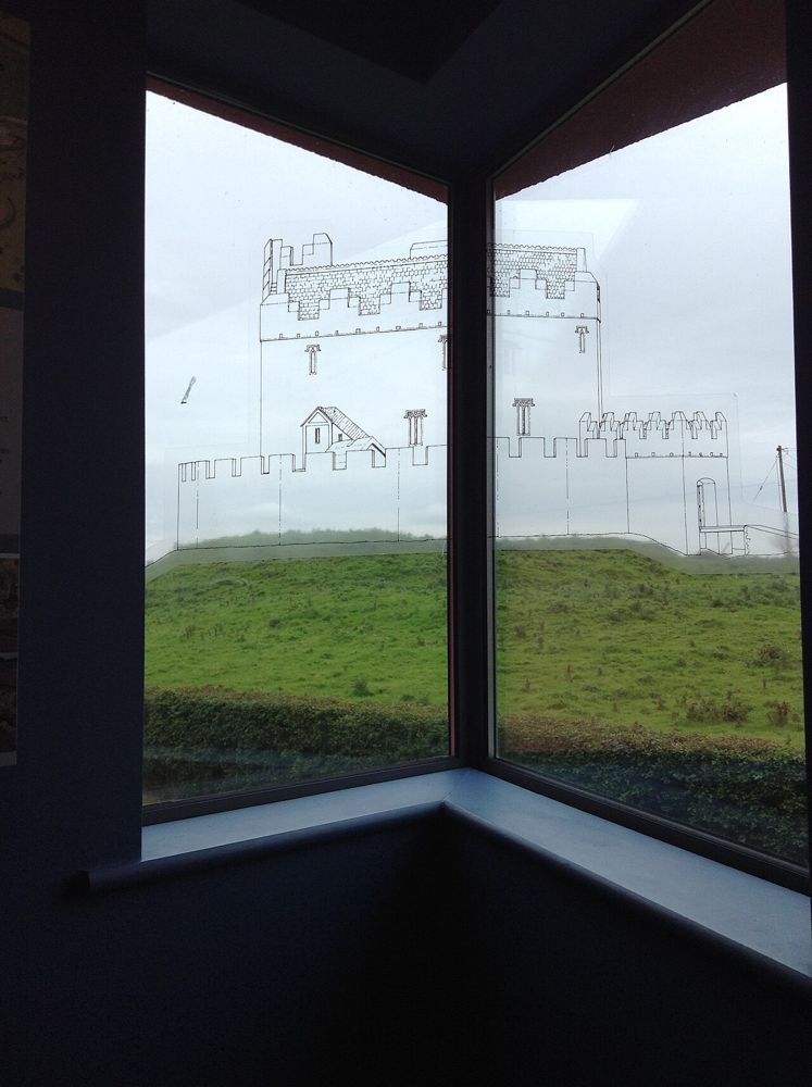 A view through the Rathcroghan Visitor Centre windows towards the surrounding countryside