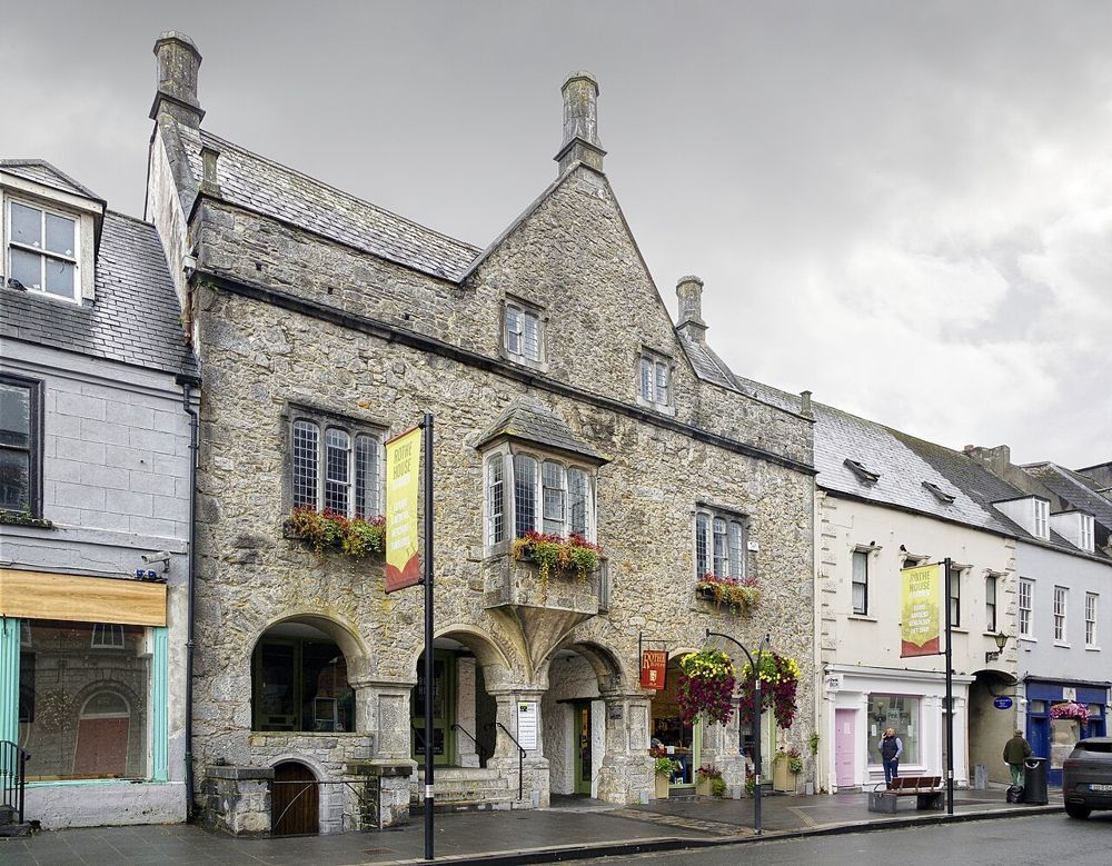 The stone street frontage and arched entrance of Rothe House in Kilkenny