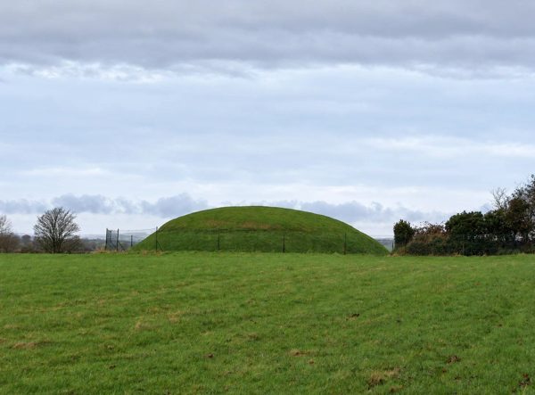 AI illustration of Fourknocks passage tomb’s grass-covered exterior mound