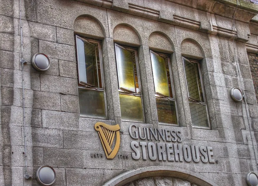 The Guinness Storehouse lettering on the stone entrance facade