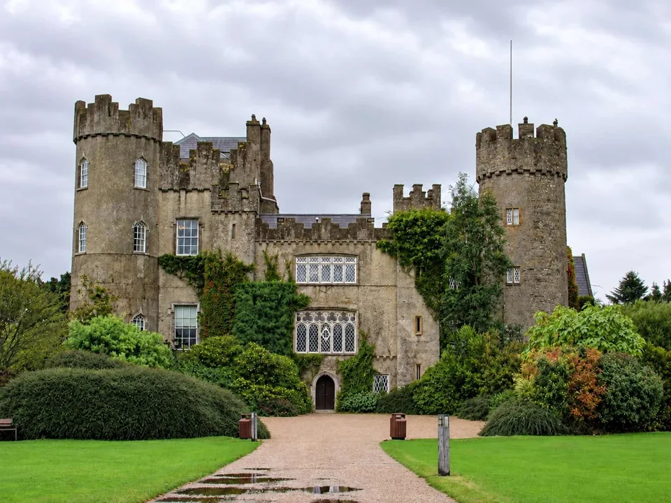 AI illustration · Malahide Castle and demesne context; playground is not shown.
