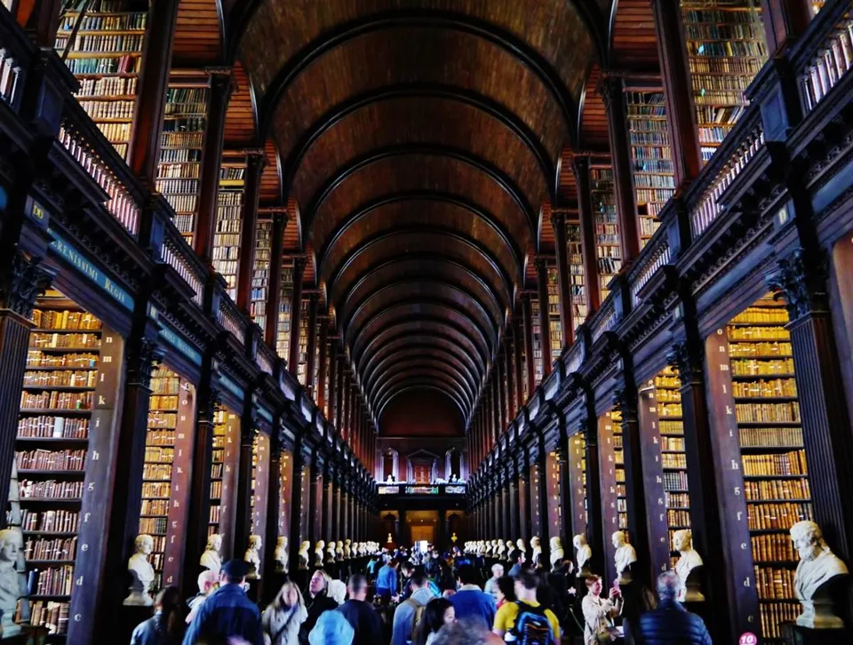 Historic 2022 view down the book-lined Long Room at Trinity College Dublin