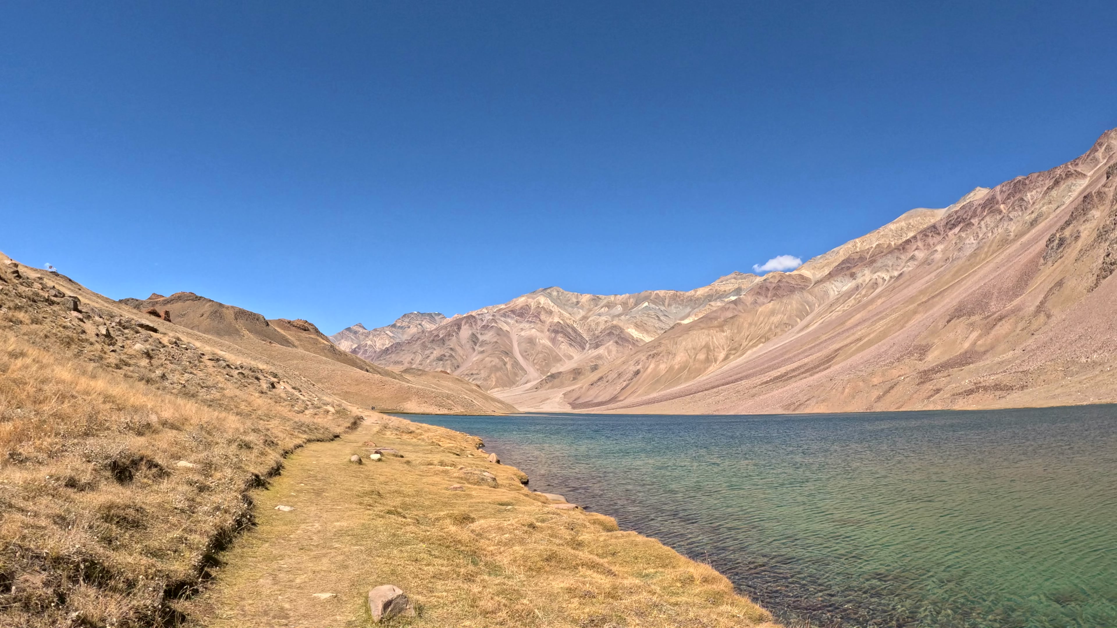 Chandrataal lake, its grassy shore and ochre mountains in Nick’s own footage from the 2024 Spiti ride.